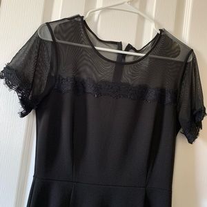 Black hi-low formal dress with mesh sleeves